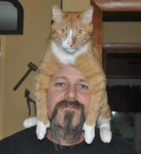 man with cat on his head